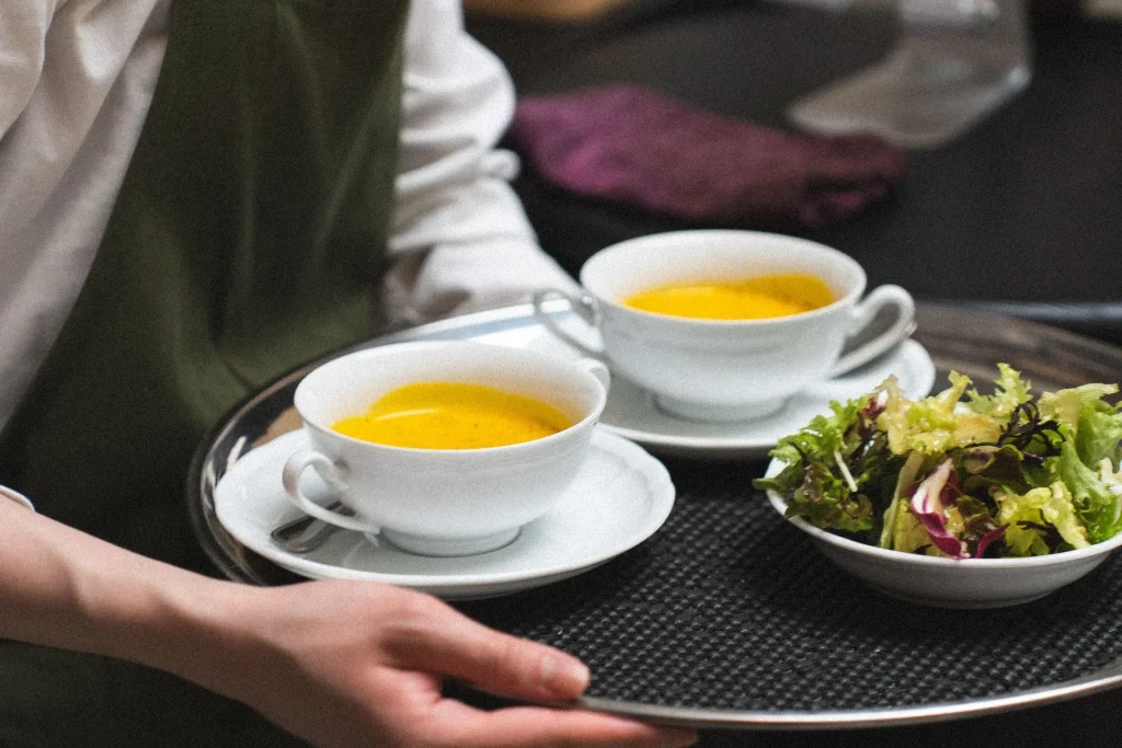Serving soup and salad on a tray